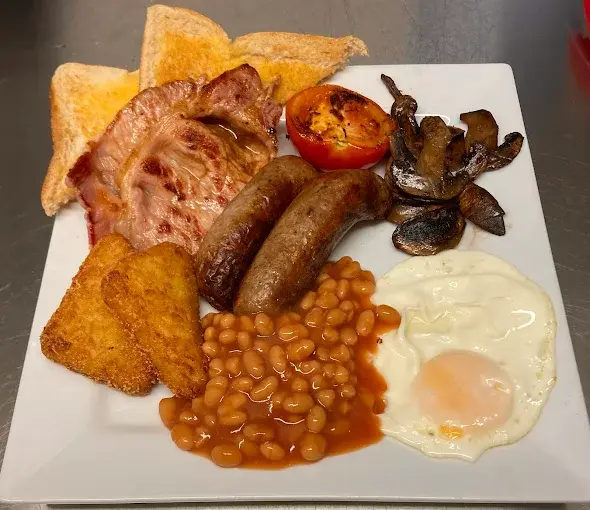 Full English breakfast with sausages, bacon, egg, beans and toast